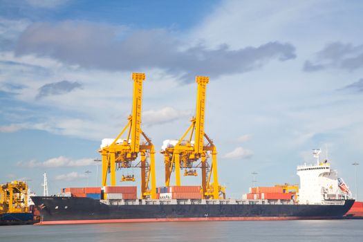 Container Cargo freight Industrial ship with working crane bridge unloading and loading goods in Bangkok shipyard Terminal for Logistic Import Export background