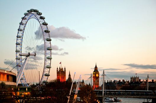 LONDON - April 15: London Eye with Big ben, on April 15, 2012 in London. The largest Ferris wheel in Europe, structure of the London Eye is 135 M. tall and the wheel has a diameter of 120 M.