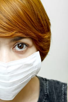 close-up woman wearing protective mask