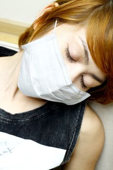 close-up woman sleep and wearing protective mask