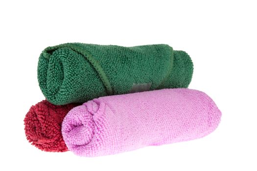 colorful towels rolls on white background