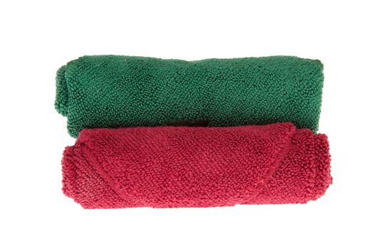 colorful towels rolls on white background