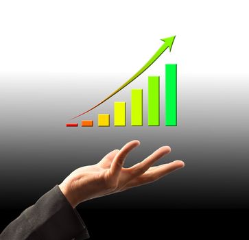 Businessman holding a growing graph 