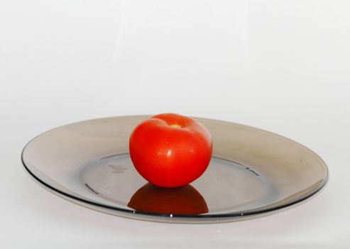 vegetables on a dark plate on a white background