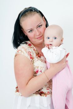mother holding a baby daughter. studio photography