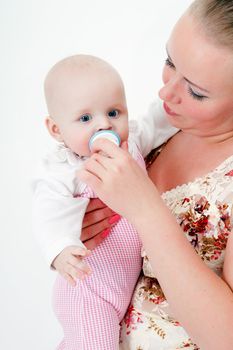 mother holding a baby daughter. studio photography