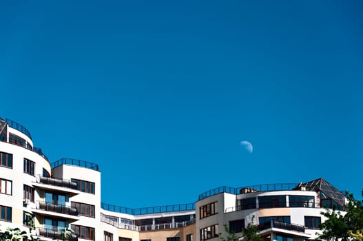 Modern house on a background of blue sky and the moon