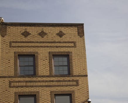 old brick building with blue skies and high quality
