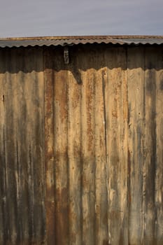 Rusty old shack with a cloudy dark day background