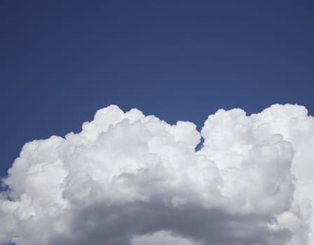 Dramatic Cloudy Sky with a deep blue background.