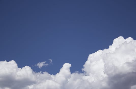 Dramatic Cloudy Sky with a deep blue background.