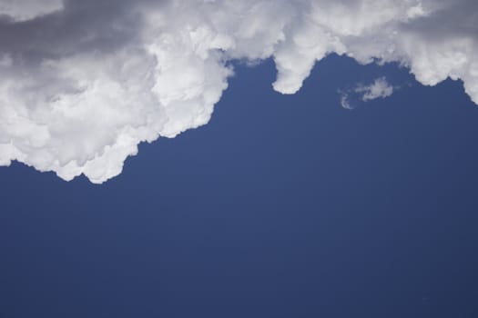 Dramatic Cloudy Sky with a deep blue background.