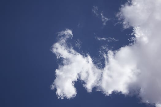 Dramatic Cloudy Sky with a deep blue background.