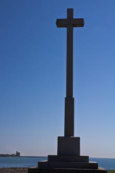 A commemorative Cross on the shore in Normandy