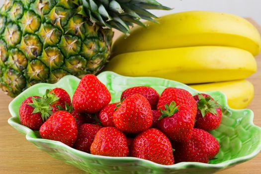 Strawberries in a Bowl with bananas and pineapple