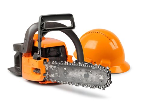 Chain saw and orange hard hat isolated, safety concept