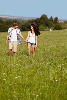 young love couple smiling outdoor in summer having fun