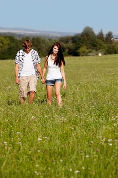 young love couple smiling outdoor in summer having fun