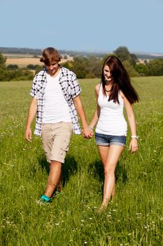 young love couple smiling outdoor in summer having fun