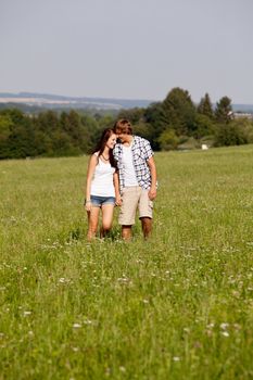 young love couple smiling outdoor in summer having fun