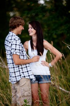 young love couple smiling outdoor in summer having fun