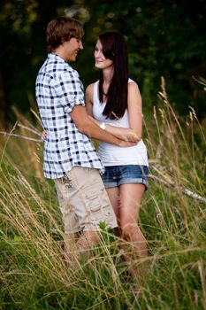 young love couple smiling outdoor in summer having fun