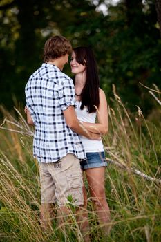 young love couple smiling outdoor in summer having fun