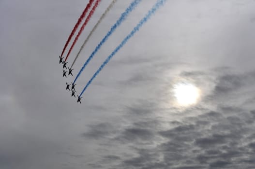French flying patrol during a show with sun in background