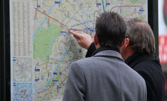 two men searching their itinerary in Paris, capital of France
