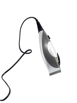 Modern electric hair clipper with cable on white background. Clipping path is included