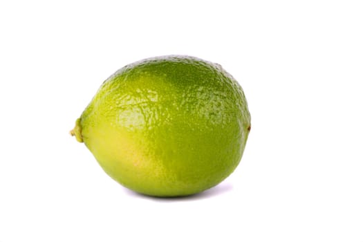 Close up view of a lime isolated on a white background with honey.