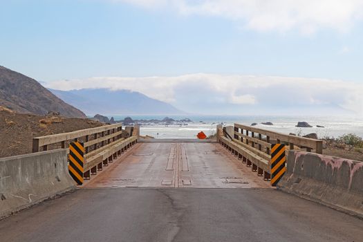 View of a bridge on Mattole Road as it heads towards the rocky beach on the Lost Coast of California