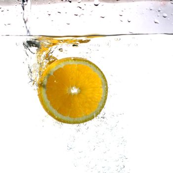 fresh orange water splash healthy concept