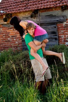 young couple in love smiling and having fun in summer outdoor 