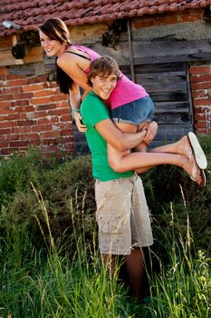 young couple in love smiling and having fun in summer outdoor 