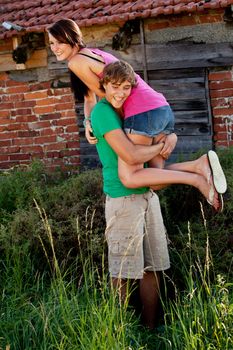 young couple in love smiling and having fun in summer outdoor 
