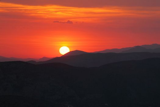 Summer landscape in mountains with the sun