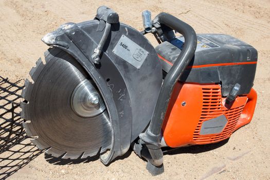 mechanical gasoline engine concrete block saw in constructions site