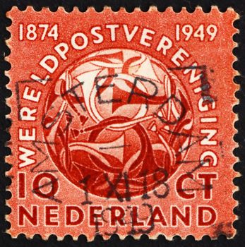 NETHERLANDS - CIRCA 1949: a stamp printed in the Netherlands shows Post Horns Entwined, 75th Anniversary of the UPU, circa 1949