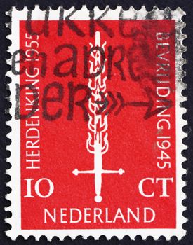 NETHERLANDS - CIRCA 1955: a stamp printed in the Netherlands shows Flaming Sword, 10th Anniversary of Netherlands' Liberation, circa 1955