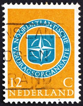 NETHERLANDS - CIRCA 1959: a stamp printed in the Netherlands shows NATO Emblem, 10th Anniversary of NATO, circa 1959