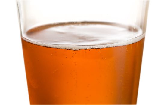 Cool glass of beer or lager with macro focus on the bubbles around surface