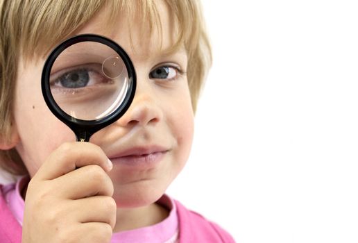Girl with magnifying glass on white background