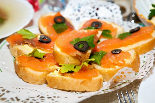 sandwiches with smoked salmon on a plate
