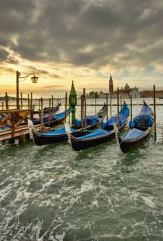 venice grunge scene with gondolas at sunset 