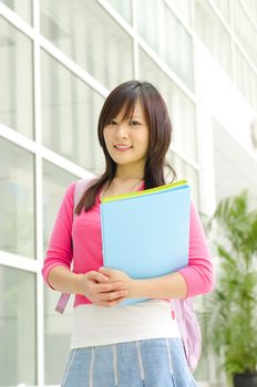 College Student standing outside college building