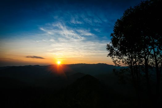 Sunset behind mountain in national Park  of thailand