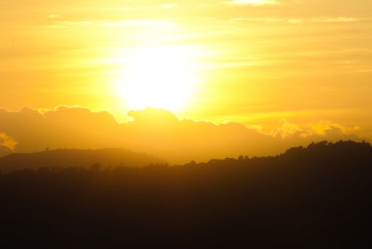 Sunset behind mountain in national Park  of thailand