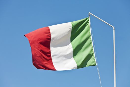 Flag of Italy towards blue sky