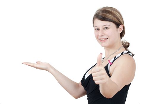cute brunette girl is advertise and thumbs up on white background
